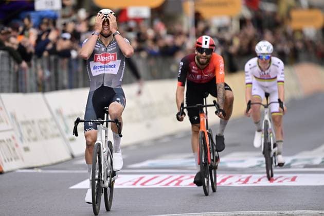 Dutch Mathieu van der Poel of Alpecin-Deceuninck (L) celebrates as he wins before Italian Filippo Ganna of Ineos Grenadiers (C) and Slovenian Tadej Pogacar of UAE Team Emirates (R) the sprint at the finish of the Milano-Sanremo one day cycling race for men, 289km from Milan to Sanremo, Italy, Saturday 22 March 2025. DIRKxWAEM  x115413405x