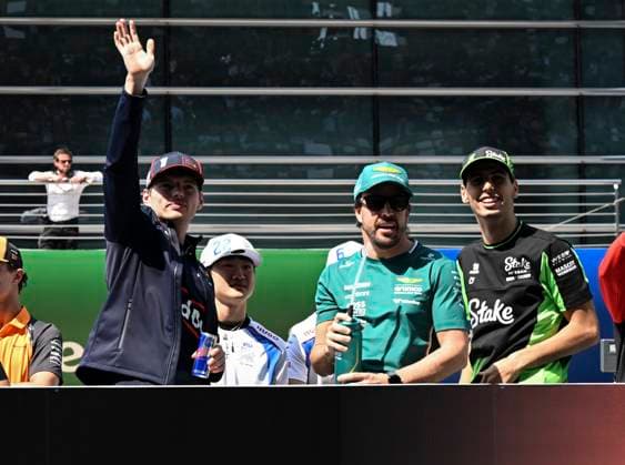 (250323) -- SHANGHAI, March 23, 2025 -- (from L to R) Red Bull s Dutch driver Max Verstappen, Racing Bulls Japanese driver Tsunoda Yuki, Aston Martin s Spanish driver Fernando Alonso and Kick Sauber s Brazilian driver Gabriel Bortoleto react during the drivers parade of the Formula 1 Chinese Grand Prix at the Shanghai International Circuit in east China s Shanghai, March 22, 2025. ) (SP)CHINA-SHANGHAI-FORMULA 1-DRIVERS PARADE (CN) HexChangshan 