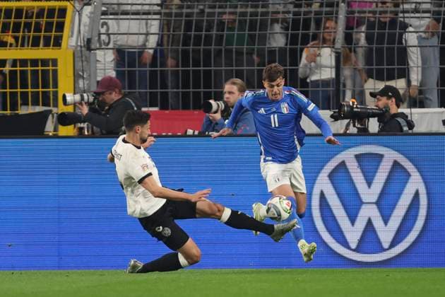 Tim Kleindienst (Deutschland) und Daniel Maldini (Italien) battle for the ball during the UEFA Nations League Quarterfinal Leg Two match between Germany and Italy at Football Stadium Dortmund on March 23, 2025 in Dortmund, Germany. (Photo by Oliver Kaelke DeFodi Images)