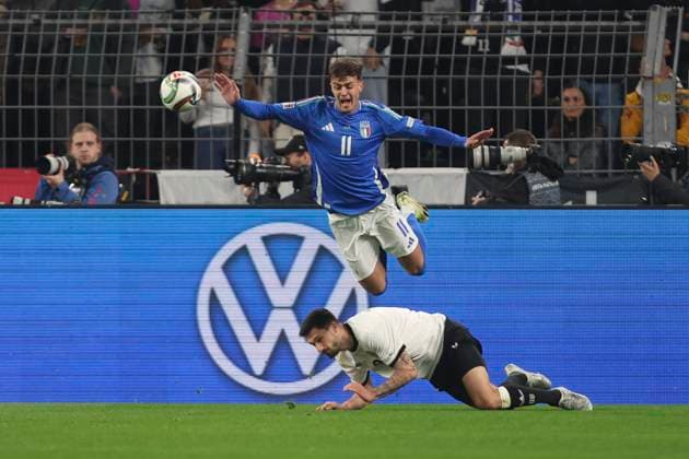 Tim Kleindienst (Deutschland) und Daniel Maldini (Italien) battle for the ball during the UEFA Nations League Quarterfinal Leg Two match between Germany and Italy at Football Stadium Dortmund on March 23, 2025 in Dortmund, Germany. (Photo by Oliver Kaelke DeFodi Images)