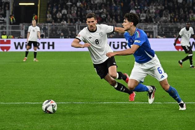 23.03.2025, xsltx, Fussball UEFA Nations League, Deutschland - Italien v.l. Leon Goretzka (Deutsche Fussball Nationalmannschaft DFB) Samuele Ricci (Italien) Zweikampf, Aktion, action, battle for the ball (DFL DFB REGULATIONS PROHIBIT ANY USE OF PHOTOGRAPHS as IMAGE SEQUENCES and or QUASI-VIDEO) Dortmund