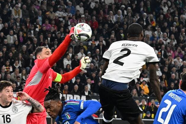 23.03.2025, xsltx, Fussball UEFA Nations League, Deutschland - Italien v.l. Gianluigi Donnaruma (Italien) Antonio Rüdiger (Deutsche Fussball Nationalmannschaft DFB) Zweikampf, Aktion, action, battle for the ball (DFL DFB REGULATIONS PROHIBIT ANY USE OF PHOTOGRAPHS as IMAGE SEQUENCES and or QUASI-VIDEO) Dortmund