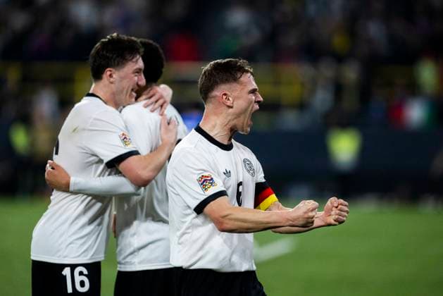 Signal-Iduna-Park, Dortmund, 23.03.2025: Jamal Musiala of Germany (M) celebrates scoring the 2:0 goal with Angelo Stiller of Germany and Joshua Kimmich of Germany during the UEFA Nations League Quarterfinal Match Germany v Italia.
