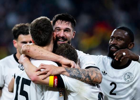 Signal-Iduna-Park, Dortmund, 23.03.2025: Tim Kleindienst of Germany celebrates scoring the 3:0 goal with Nico Schlotterbeck of Germany and Joshua Kimmich of Germany during the UEFA Nations League Quarterfinal Match Germany v Italia.