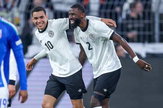 23.03.2025, Fußball, Viertelfinale UEFA Nations League, Deutschland - Italien, Signal Iduna Park, Saison 2024 2025: Torjubel nach dem Tor zum 2:0 durch Torschütze Jamal Musiala (GER 10) zusammen mit Antonio Rüdiger (GER 02) DFB regulations prohibit any use of photographs as image sequences and or quasi-video. Nordrhein-Westfalen Deutschland