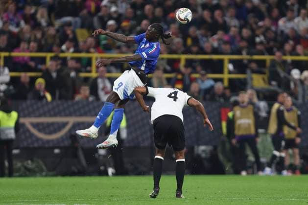 Moise Kean (Italien) und Jonathan Tah (Deutschland) battle for the ball during the UEFA Nations League Quarterfinal Leg Two match between Germany and Italy at Football Stadium Dortmund on March 23, 2025 in Dortmund, Germany. (Photo by Oliver Kaelke DeFodi Images)