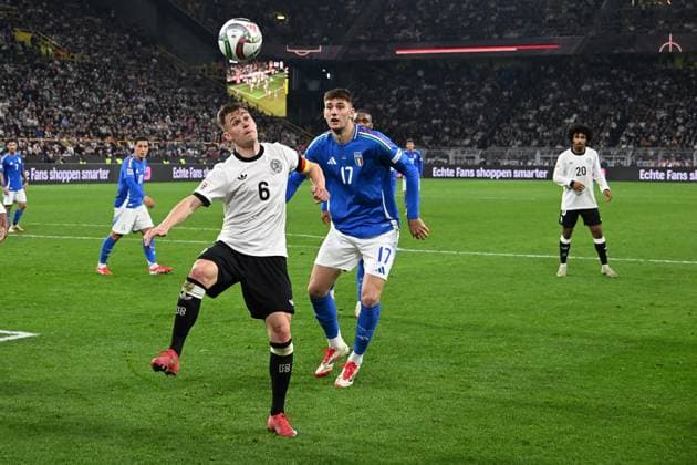 23.03.2025, xsltx, Fussball UEFA Nations League, Deutschland - Italien v.l. Joshua Kimmich (Deutsche Fussball Nationalmannschaft DFB) Matteo Ruggeri (Italien) Zweikampf, Aktion, action, battle for the ball (DFL DFB REGULATIONS PROHIBIT ANY USE OF PHOTOGRAPHS as IMAGE SEQUENCES and or QUASI-VIDEO) Dortmund