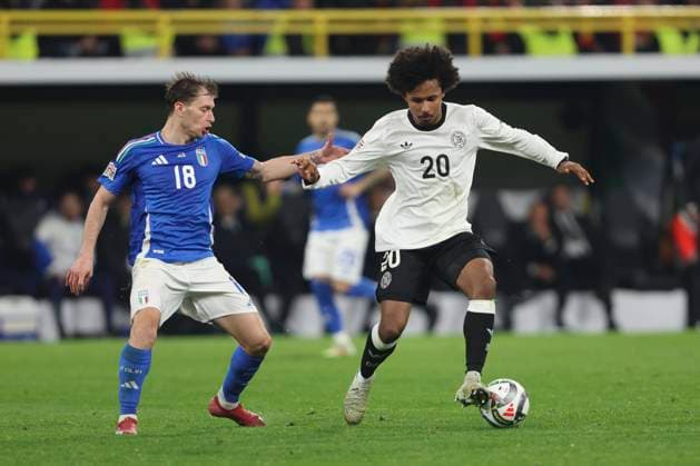 Nicolo Barella (Italien) und Karim Adeyemi (Deutschland) battle for the ball during the UEFA Nations League Quarterfinal Leg Two match between Germany and Italy at Football Stadium Dortmund on March 23, 2025 in Dortmund, Germany. (Photo by Oliver Kaelke DeFodi Images)