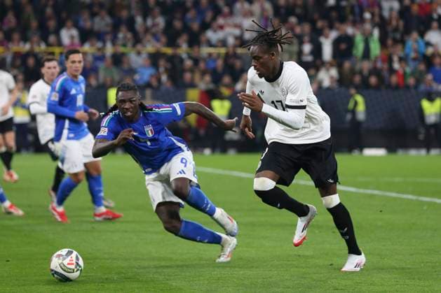 Moise Kean (Italien) und Yann Bisseck (Deutschland) battle for the ball during the UEFA Nations League Quarterfinal Leg Two match between Germany and Italy at Football Stadium Dortmund on March 23, 2025 in Dortmund, Germany. (Photo by Oliver Kaelke DeFodi Images)
