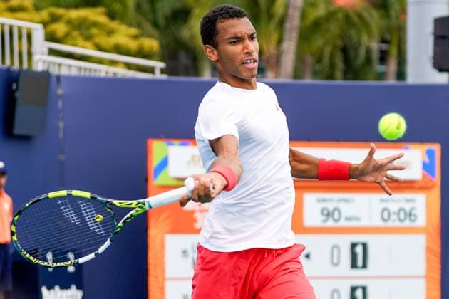 March 23, 2025, Miami, Florida, USA: Felix Auger-Aliassime (CAN) returns a shot to Lorenzo Musetti (not pictured) during the men s singles third round match at the 2025 Miami Open presented by Itau at Hard Rock Stadium. Miami USA - ZUMAw109 20250323_fap_w109_028 Copyright: xDebbyxWongx