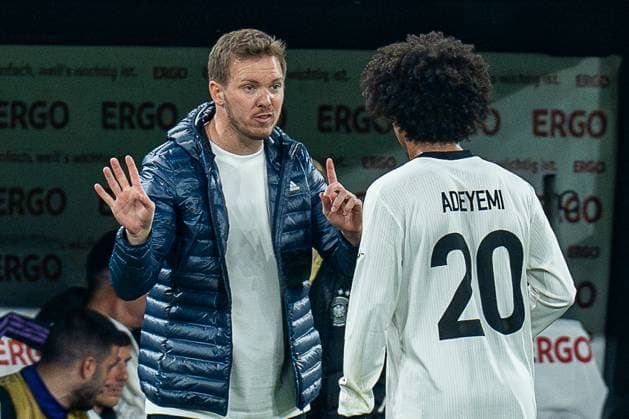 23.03.2025, Deutschland vs. Italien, Nations League, Viertelfinale-Rückspiel Julian Nagelsmann (Deutschland, Chef-Trainer) und Karim Adeyemi (Deutschland, 20) Copyright: xBahhoxKarax