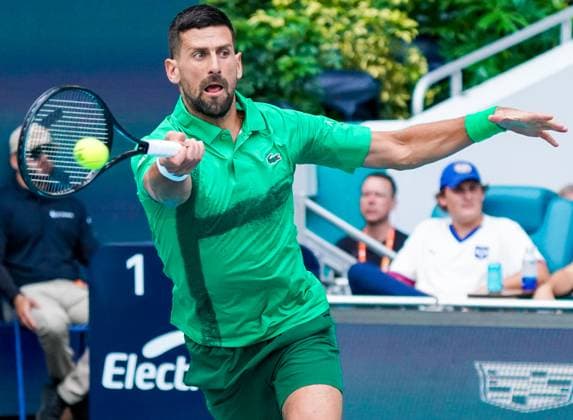 March 23, 2025, Miami, Florida, USA: Novak Djokovic (SRB) returns a shot from Camilo Ugo Carabelli (not pictured) during the men s singles third round match at the 2025 Miami Open presented by Itau at Hard Rock Stadium. Miami USA - ZUMAw109 20250323_fap_w109_054 Copyright: xDebbyxWongx