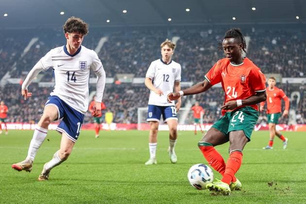England v Portugal - Men s U21, U 21 International 24, Joelson Fernandes of Portugal U21s fires the ball past 14, Archie Gray of England U21s during the Under 21 International Friendly, Länderspiel, Nationalmannschaft match between England and Portugal at The Hawthorns in West Bromwich, England, on March 24, 2025. West Bromwich West Midlands United Kingdom  Copyright: xMIxNewsx originalFilename:fletcher-englandu250324_npLEg.jpg