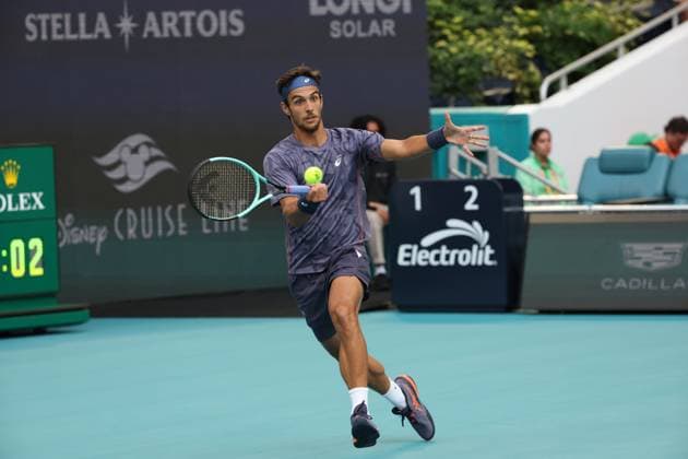 March 25, 2025, Miami Gardens, Florida, United States Of America: MIAMI GARDENS, FLORIDA - MARCH 25: Novak Djokovic of Serbia defeats Lorenzo Musetti of Italy in the fourth round of the men s singles during Day 8 of the Miami Open at Hard Rock Stadium on March 25, 2025 in Miami Gardens, Florida....People: Lorenzo Musetti Miami Gardens United States Of America - ZUMAs214 20250325_ada_s214_148 Copyright: xSMGx