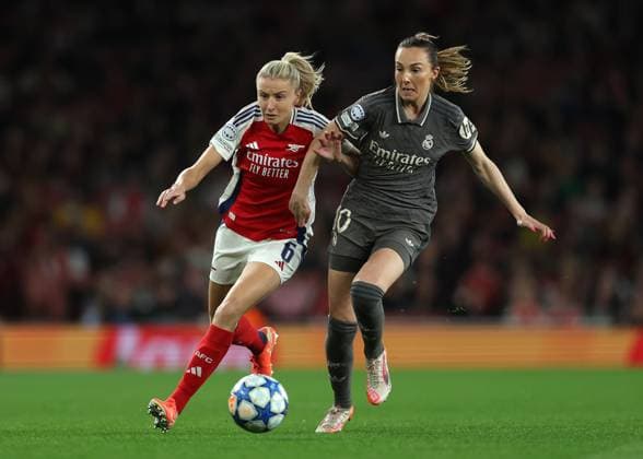 London, England, 26th March 2025. Leah Williamson of Arsenal and Caroline Weir of Real Madrid challenge for the ball during the UEFA Womens Champions League match at the Emirates Stadium, London. Picture credit should read: Paul Terry Sportimage EDITORIAL USE ONLY. No use with unauthorised audio, video, data, fixture lists, club league logos or live services. Online in-match use limited to 120 images, no video emulation. No use in betting, games or single club league player publications. SPI_007_PT_Arsenal_w_Real_Madrid_w SPI-3768-0007