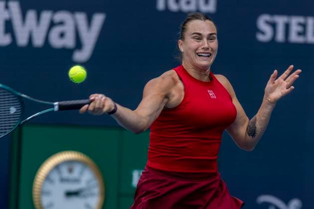 Aryna Sabalenka of Belarus hits a forehand during play against Jasmine Paolini in of Italy in the first semifinal match on the stadium court at the Miami Open in the Hard Rock Stadium in Miami Gardens, Florida, on Thursday, March 27, 2025. Sabalenka defeated Paolini 6-2, 6-2.  MIA20250327102 GARYxIxROTHSTEIN