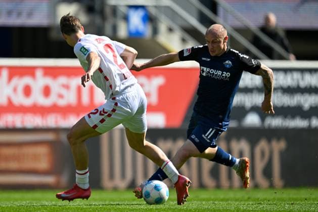 Paderborn, Home Deluxe Arena, 29.03.25, GER, Herren, 2.Bundesliga, Saison 2024-2025, SC Paderborn 07 - 1.FC Koeln Bild: v.li. im Zweikampf Joel Pascal SCHMIED (Koeln) und Sven MICHEL (Paderborn) DFL regulations prohibit any use of photographs as image sequences and or quasi-video. NRW Deutschland