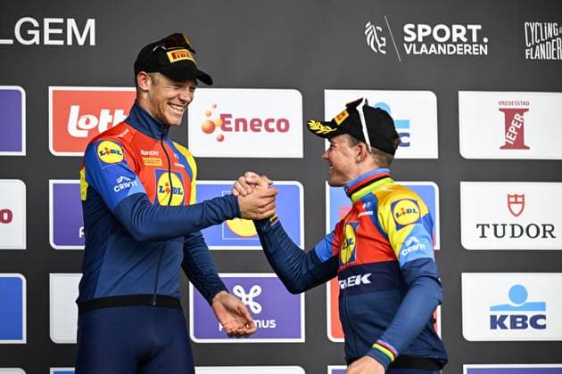 Italian Jonathan Milan of Lidl-Trek and Danish Mads Pedersen of Lidl-Trek celebrate on the podium after winning the men elite Gent-Wevelgem - In Flanders Fields one day cycling race, 250.3 km from Ieper to Wevelgem, Sunday 30 March 2025. JASPERxJACOBS  x117247258x