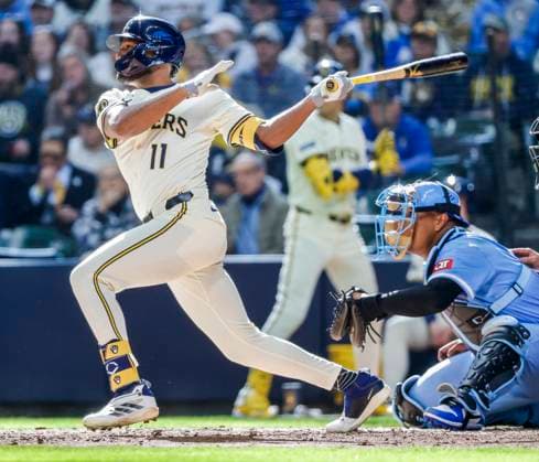 Milwaukee Brewers designated hitter Jackson Chourio hits an RBI single in front of Kansas City Royals catcher Salvador Perez (R) in the seventh inning of the MLB, Baseball Herren, USA baseball game between the Kansas City Royals and the Milwaukee Brewers at American Family Field in Milwaukee, Wisconsin on Monday, March 31, 2025. The game is the Brewers 2025 season home opener.  MIL20250331829 TANNENxMAURY