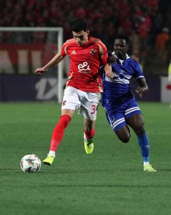 CAF Champions League - Quarter Final - First Leg - Al Ahly vs Al Hilal Omdurman Achraf Bencharki (L) of Al Ahly in action againstt Jean Claude Girmugisha of Al Hilal Omdurman during the CAF Champions League Quarter Final First Leg match between Al Ahly vs Al Hilal Omdurman, in Cairo, Egypt,April 01 2025. Cairo Egypt Copyright: xMatrixxImagesx xKhaledxElfiqix 