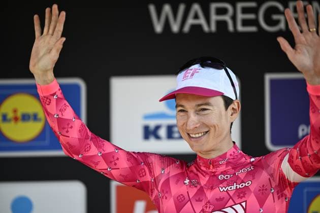 American Neilson Powless of EF Education-EasyPost celebrates on the podium after winning the men elite race of the Dwars Door Vlaanderen cycling event, 184,2km from Roeselare to Waregem, Wednesday 02 April 2025. JASPERxJACOBS  x118320378x
