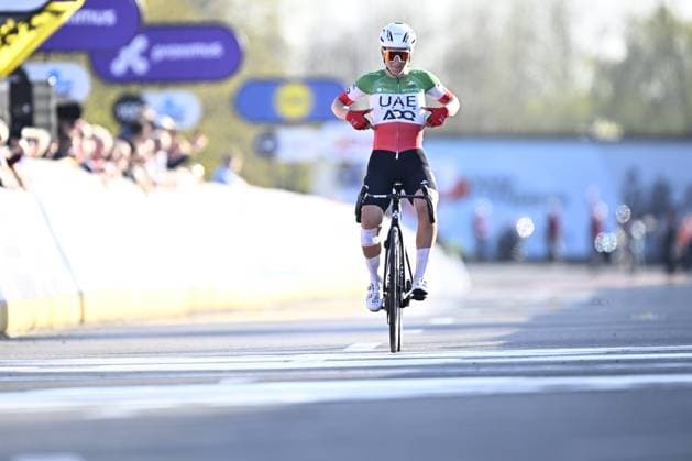 Italian Elisa Longo Borghini of UAE Team ADQ celebrates after winning the women elite race of the Dwars Door Vlaanderen cycling event, 128,5km from and to Waregem, Wednesday 02 April 2025. JASPERxJACOBS  x118336919x