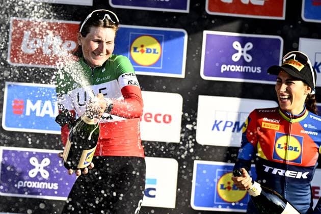 Italian Elisa Longo Borghini of UAE Team ADQ and Italian Elisa Balsamo of Lidl-Trek celebrate on the podium of the women elite race of the Dwars Door Vlaanderen cycling event, 128,5km from and to Waregem, Wednesday 02 April 2025. JASPERxJACOBS  x118342231x