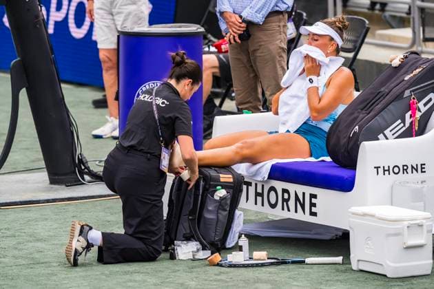April 2, 2025, Daniel Island, Sc, USA: IRYNA SHMANOVICH (Q) (RUS) takes a medical timeout to have her foot re wrapped during her match against Jessica Pegula (1) USA) at the Credit One Charleston Open on Daniel Island, SC. Pegula defeats Shmanovich 6-0, 6-3 to move to the 3rd round. Daniel Island USA - ZUMAa161 20250402_aaa_a161_246 Copyright: xWalterxG.xArcexSr.x