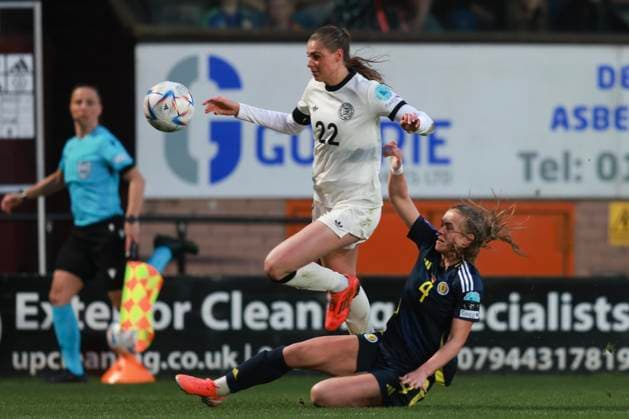 4th April 2025; Tannadice, Dundee, Scotland: Womens Nations League International Football, Scotland versus Germany; Jule Brand of Germany goes past the sliding tackle from Leah Eddie of Scotland  ActionPlus12769504 DavidxYoung