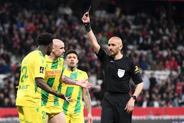 OGC Nice v FC Nantes - Ligue 1 McDonald s 2024 2025 04 Nicolas PALLOIS (fcn) - Hakim BEN EL HADJ (ARBITRE) during the Ligue 1 McDonald s match between Nice and Nantes on April 4, 2025 at Allianz Riviera in Nice, France. Nice France  Copyright: xFEPx 776305186