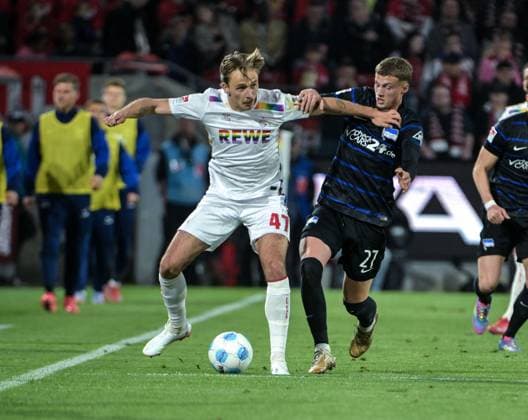 05.04.2025, xjpx, Fussball 2.Bundesliga, 1.FC Koeln - Hertha BSC v.l. Zweikampf zwischen Michael Cuisance (Berlin) und Mathias Olesen (Koeln) (DFL DFB REGULATIONS PROHIBIT ANY USE OF PHOTOGRAPHS as IMAGE SEQUENCES and or QUASI-VIDEO) Koeln