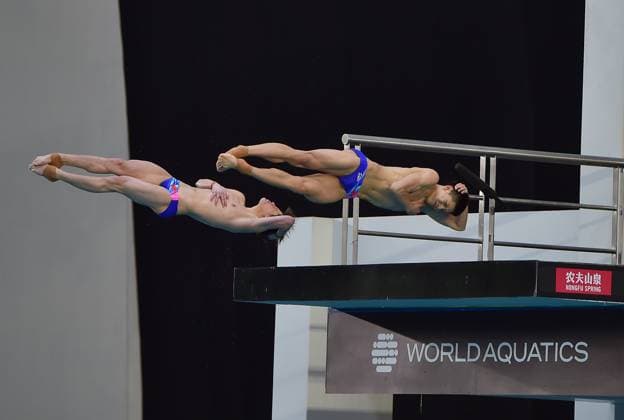 (250406) -- GUADALAJARA, April 6, 2025 -- Zhu Zifeng (L) Cheng Zilong of China compete during the men s 10m synchronized final at the World Aquatics Diving World Cup 2025 in Guadalajara, Jalisco, Mexico, on April 5, 2025. (Photo by Xinhua) (SP)MEXICO-JALISCO-GUADALAJARA-DIVING-WORLD CUP-MEN S 10M SYNCHRONIZED-FINAL AlejandroxAcosta 