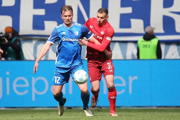 06.04.2025, xmohx, Fussball 2.Bundesliga, 1.FC Magdeburg - 1.FC Kaiserslautern v.l. Alexander Ahl-Holmström (1.FC Magdeburg) Luca Sirch (1. FC Kaiserslautern) Zweikampf, Aktion, action, battle for the ball (DFL DFB REGULATIONS PROHIBIT ANY USE OF PHOTOGRAPHS as IMAGE SEQUENCES and or QUASI-VIDEO) Magdeburg