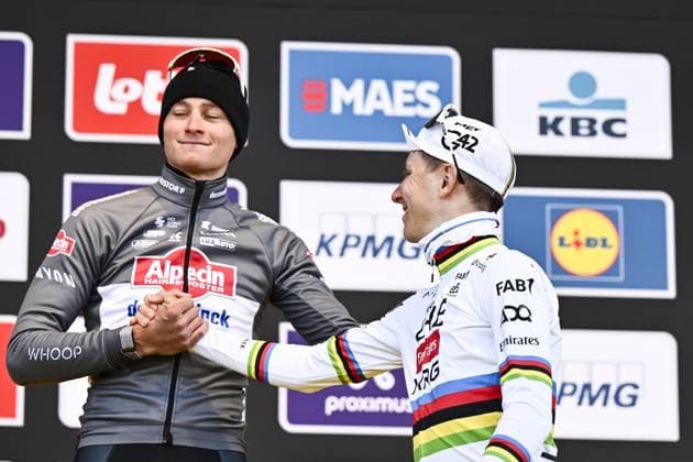 Slovenian Tadej Pogacar of UAE Team Emirates and Dutch Mathieu van der Poel of Alpecin-Deceuninck pictured on the podium after the men s race of the Ronde van Vlaanderen Tour des Flandres Tour of Flanders one day cycling race, 268,9km from Brugge to Oudenaarde, Sunday 06 April 2025. ERICxLALMAND  x119652001x