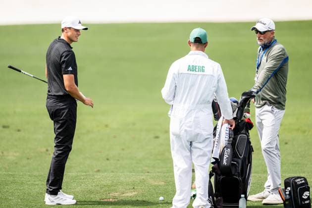 250406 Ludvig Aberg of Sweden with caddie Joe Skovron and coach Hans Larsson during a practice at the range prior to the 2025 Masters Golf Tournament on April 6, 2025 in Augusta. Photo: Petter Arvidson BILDBYRAN kod PA PA1003 golf masters bbeng the masters augusta sverige Copyright: PETTERxARVIDSON BB250406PA023
