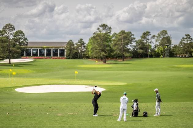 250406 Ludvig Aberg of Sweden with caddie Joe Skovron and coach Hans Larsson during a practice at the range prior to the 2025 Masters Golf Tournament on April 6, 2025 in Augusta. Photo: Petter Arvidson BILDBYRAN kod PA PA1003 golf masters bbeng the masters augusta sverige Copyright: PETTERxARVIDSON BB250406PA036