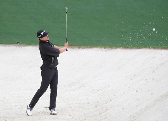 Nico Echavarria of Columbia hits from the bunker on the 10th hole before play is suspended due to lightning and thunderstorms in the area during a practice round leading up the Masters Tournament at Augusta National Golf Club in Augusta, Georgia on Monday, April 7, 2025.  AUG20250407115 JOHNxANGELILLO