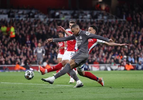 London, England, 8th April 2025. Kylian Mbappe of Real Madrid shoots on goal during the Arsenal vs Real Madrid UEFA Champions League match at the Emirates Stadium, London. Picture credit should read: David Klein Sportimage EDITORIAL USE ONLY. No use with unauthorised audio, video, data, fixture lists, club league logos or live services. Online in-match use limited to 120 images, no video emulation. No use in betting, games or single club league player publications. SPI_052_DK_Arsenal_Real_Madrid SPI-3819-0060