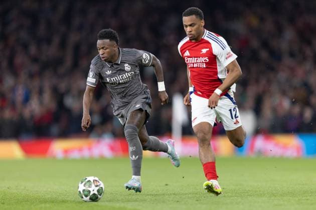 Arsenal v Real Madrid. UEFA Champions League, Quarter-Final, Leg 1 of 2, Football, The Emirates Stadium, London, UK - 08 Apr 2025 Vinicius Junior of Real Madrid and Jurrien Timber of Arsenal FC London Emirates Stadium London GBR, UK NEWSPAPERS OUT Copyright: xEllixBirchx