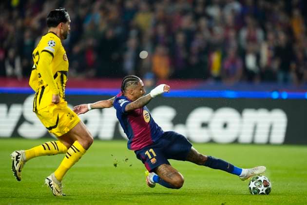 FC Barcelona, Barca v Borussia Dortmund - UEFA Champions League 2024 25 Quarter Final First Leg Raphinha right winger of Barcelona and Brazil shooting to goal front Emre Can defensive midfield of Borussia Dortmund and Germany during the UEFA Champions League 2024 25 Quarter Final First Leg match between FC Barcelona and Borussia Dortmund at Estadi Olimpic Lluis Companys on April 9, 2025 in Barcelona, Spain. Barcelona Spain  Copyright: xJosexBretonx originalFilename:bretonhernandez-fcbarcel250409_npkBj.jpg