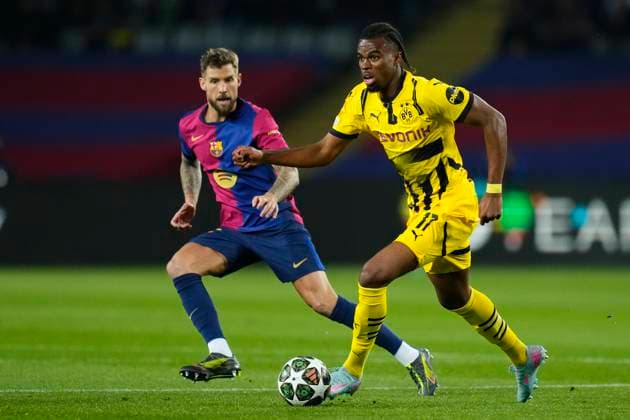 FC Barcelona, Barca v Borussia Dortmund - UEFA Champions League 2024 25 Quarter Final First Leg Carney Chukwuemeka central midfield of Borussia Dortmund and England and Inigo Martinez centre-back of Barcelona and Spain compete for the ball during the UEFA Champions League 2024 25 Quarter Final First Leg match between FC Barcelona and Borussia Dortmund at Estadi Olimpic Lluis Companys on April 9, 2025 in Barcelona, Spain. Barcelona Spain  Copyright: xJosexBretonx originalFilename:bretonhernandez-fcbarcel250409_np1PA.jpg
