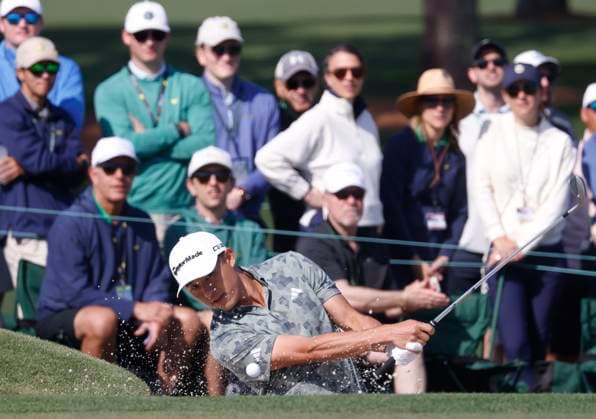 Collin Morikawa hits out of a bunker on the second hole during the first round of the Masters golf tournament at Augusta National Golf Club in Augusta, Georgia on Thursday, April 10, 2025.  AUG20250410529 TANNENxMAURY