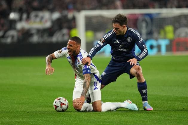 Corentin Tolisso of Lyon is fouled by Manuel Ugarte of Man Utd Olympique Lyonnais v Manchester United, ManU UEFA Europa League, Quarter Final, First Leg, Football, Groupama Stadium, Lyon, France - 10 Apr 2025 EDITORIAL USE ONLY No use with unauthorised audio, video, data, fixture lists, club league logos or live services. Online in-match use limited to 120 images, no video emulation. No use in betting, games or single club league player publications. Copyright: xDavexWinter Shutterstockx 15243617y