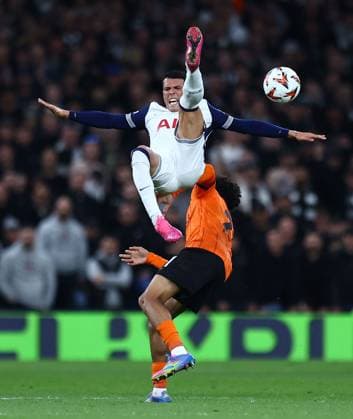 Pedro Porro of Tottenham Hotspur is fouled by Nathaniel Brown of Eintracht Frankfurt Tottenham Hotspur v Eintracht Frankfurt, UEFA Europa League, Quarter Final, First Leg, Football, Tottenham Hotspur Stadium, London, UK - 10 Apr 2025 EDITORIAL USE ONLY No use with unauthorised audio, video, data, fixture lists, club league logos or live services. Online in-match use limited to 120 images, no video emulation. No use in betting, games or single club league player publications. Copyright: xMichaelxZemanek Shutterstockx 15243632v