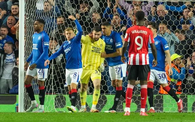 Rangers goalkeeper Liam Kelly is congratulated by Leon Balogun of Rangers after saving a penalty kick from Alex Berenguer of Athletic Bilbao. Rangers v Athletic Bilbao, UEFA Europa League, Quarter Final, First Leg, Football, Ibrox Stadium, Glasgow, Scotland, UK - 10 Apr 2025 EDITORIAL USE ONLY No use with unauthorised audio, video, data, fixture lists, club league logos or live services. Online in-match use limited to 120 images, no video emulation. No use in betting, games or single club league player publications. Copyright: xStuartxWallace Shutterstockx 15243627br