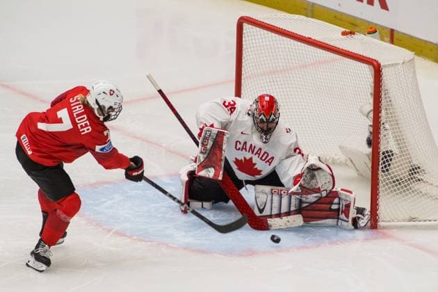 Lara Stalder of Switzerland, left, and goalkeeper Ann-Renee Desbiens of Canada in action during the Ice hockey, Eishockey IIHF Women s World Championship, WM, Weltmeisterschaft Group A, match Switzerland vs Canada, Ceske Budejovice, Czech Republic, April 11, 2025. (CTKxPhoto PetrxSkrivanek) CTKPhotoP2025041105879 CTKPhotoP2025041105879