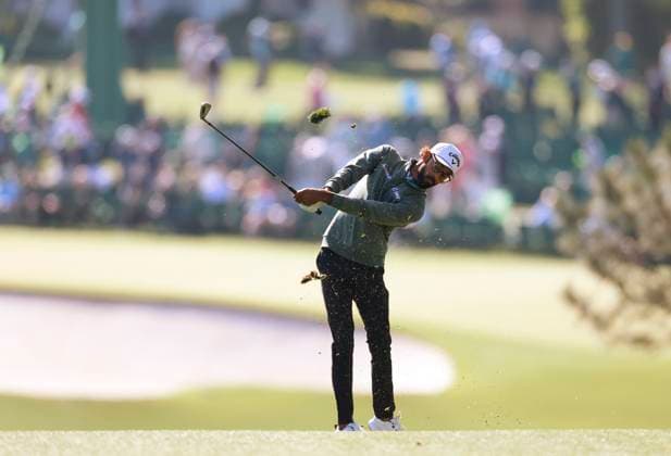 Akshay Bhatia hits his approach shot to the first hole during round two of the 2025 Masters golf tournament at Augusta National Golf Club in Augusta, Georgia, on Friday, April 11, 2025.  AUG20250411533 JOHNxANGELILLO