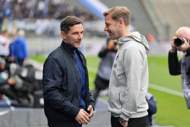 2. Fußball Bundesliga, Hertha BSC - SV Darmstadt Trainer Stefan Leitl (Hertha BSC Berlin), links, und Trainer Florian Kohfeldt (SV Darmstadt), während der Begegnung in der 2. Fußball Bundesliga, Hertha BSC - SV Darmstadt in Berlin, Olympiastadion, am 12.04.2025. DFB regulations prohibit any use of photographs as image sequences and or quasi video.