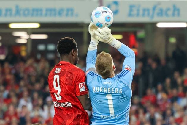 12.04.2025, xmohx, Fussball 2.Bundesliga, 1.FC Kaiserslautern - 1.FC Nürnberg v.l. Ragnar Ache (1. FC Kaiserslautern) Jan Reichert (1.FC Nuernberg) Zweikampf, Aktion, action, battle for the ball (DFL DFB REGULATIONS PROHIBIT ANY USE OF PHOTOGRAPHS as IMAGE SEQUENCES and or QUASI-VIDEO) Kaiserslautern