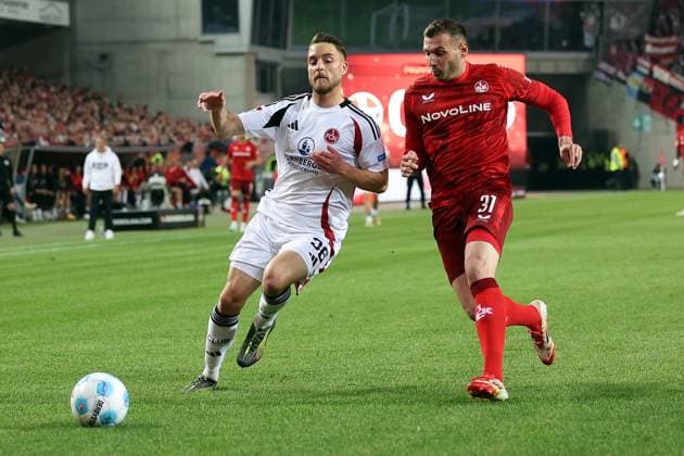 12.04.2025, xrekx, Fussball 2.Bundesliga, 1.FC Kaiserslautern - 1.FC Nürnberg v.l. Lukas Schleimer (1.FC Nuernberg) Luca Sirch (1.FC Kaiserslautern) Zweikampf, Aktion, action, battle for the ball (DFL DFB REGULATIONS PROHIBIT ANY USE OF PHOTOGRAPHS as IMAGE SEQUENCES and or QUASI-VIDEO) Kaiserslautern